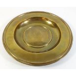 A brass alms dish by Cox, Buckley & Co, 25.5cm diameter