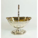 A George III silver sugar basket with silver gilt interior and bright cut decoration, London 1793 by