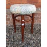 A mahogany bentwood cafe stool - 49cm tall