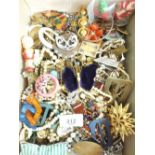 A tray of costume jewellery inc. brooches, necklaces, bracelets etc.