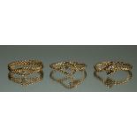 Three 14 carat gold spiral twist rings set diamonds, size k, total 3.2g