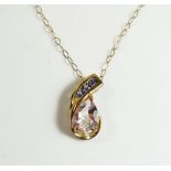 A 9ct gold pendant set coloured stones on a fine 9ct gold chain