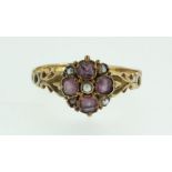 A Victorian 15 carat gold amethyst and pearl ring, size N