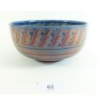 A William De Morgan bowl decorated by Fred Passenger with dolphin head inner border and stylized