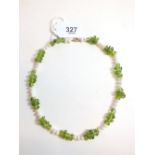 A freshwater pearl and peridot necklace