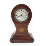 An early 20th Century mahogany balloon form mantel clock with decorative inlay, retailed by Aspreys,