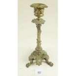 A 19th Century brass candlestick in a Baroque revival style with central coiled snake and snail