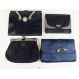 A group of four black satin vintage evening bags with applied silver and marcasite decoration