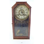 An American shelf clock with gilt decoration to glazed door