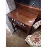 A 1950's McMichael TT4 radio in mahogany table/cabinet with castors - reported to be working