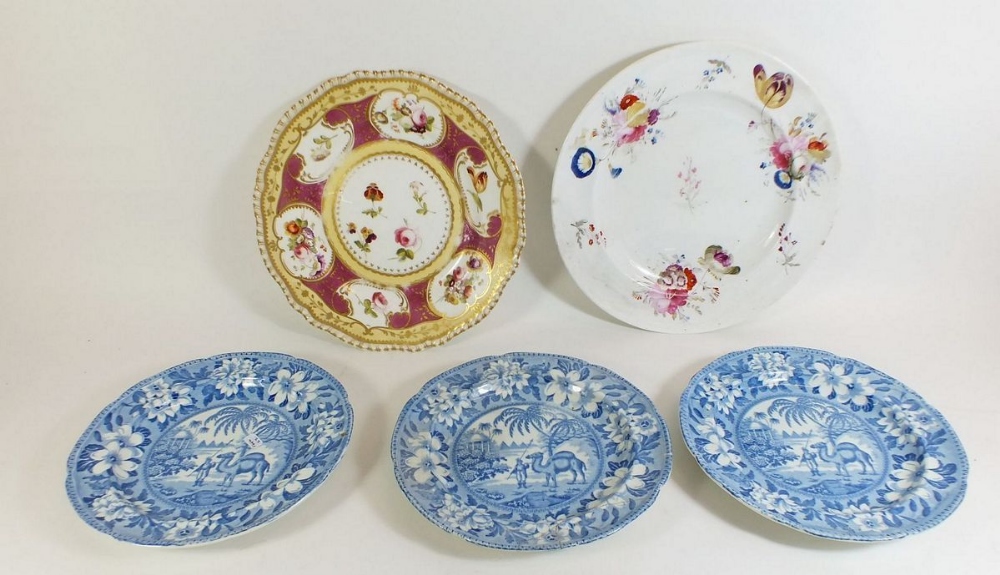 Two 19th century porcelain plates painted flowers and three blue and white plates printed camels