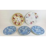 Two 19th century porcelain plates painted flowers and three blue and white plates printed camels