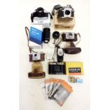 A quantity of cameras and lenses including a Nikon F65 camera, a Tokina 60 - 300mm lenses etc