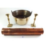 A small brass jam pan together with a copper tube and small brass candlesticks