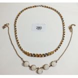 A gold and silver tri-colour necklace and a silver moonstone necklace