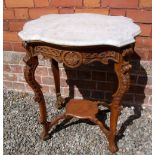A Chinese carved hardwood marble topped carved occasional table