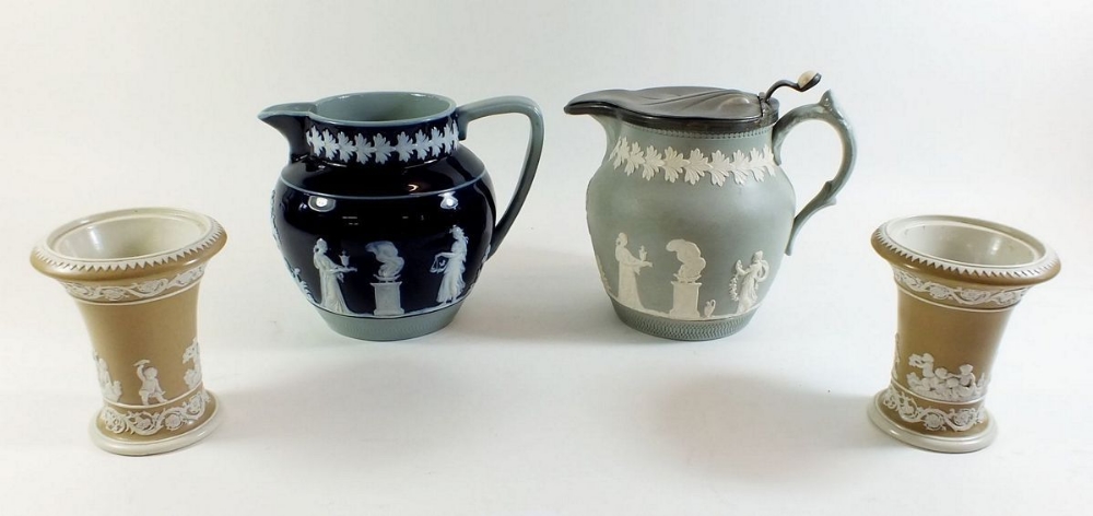 Two 19th Century Copeland stoneware jugs with Jasperware style relief moulded decoration and a