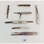 Two silver and mother of pearl folding fruit knives, two silver penknives a/f, a stone set