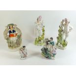 A selection of four Staffordshire figures and a fairy
