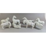 A group of seven Chinese white porcelain horses, 6 to 8cm tall