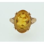 A 9ct gold ring set orange stone, size I