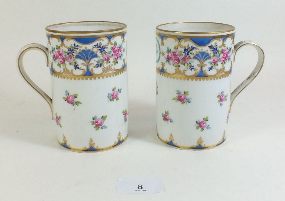 A pair of Potschappel Dresden porcelain mugs with floral decoration