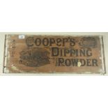 A wooden packing crate board advertising Coopers Sheep Dipping Powder 65 x 25cm
