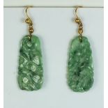 A pair of green carved jade pendant earrings, 3.3cm drop