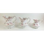 A set of three Doulton Burslem graduated jugs in the Empire pattern - 16.5cm