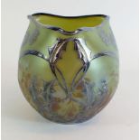 An early 20th century Loetz style Austrian iridescent glass vase with Art Nouveau silver overlay (