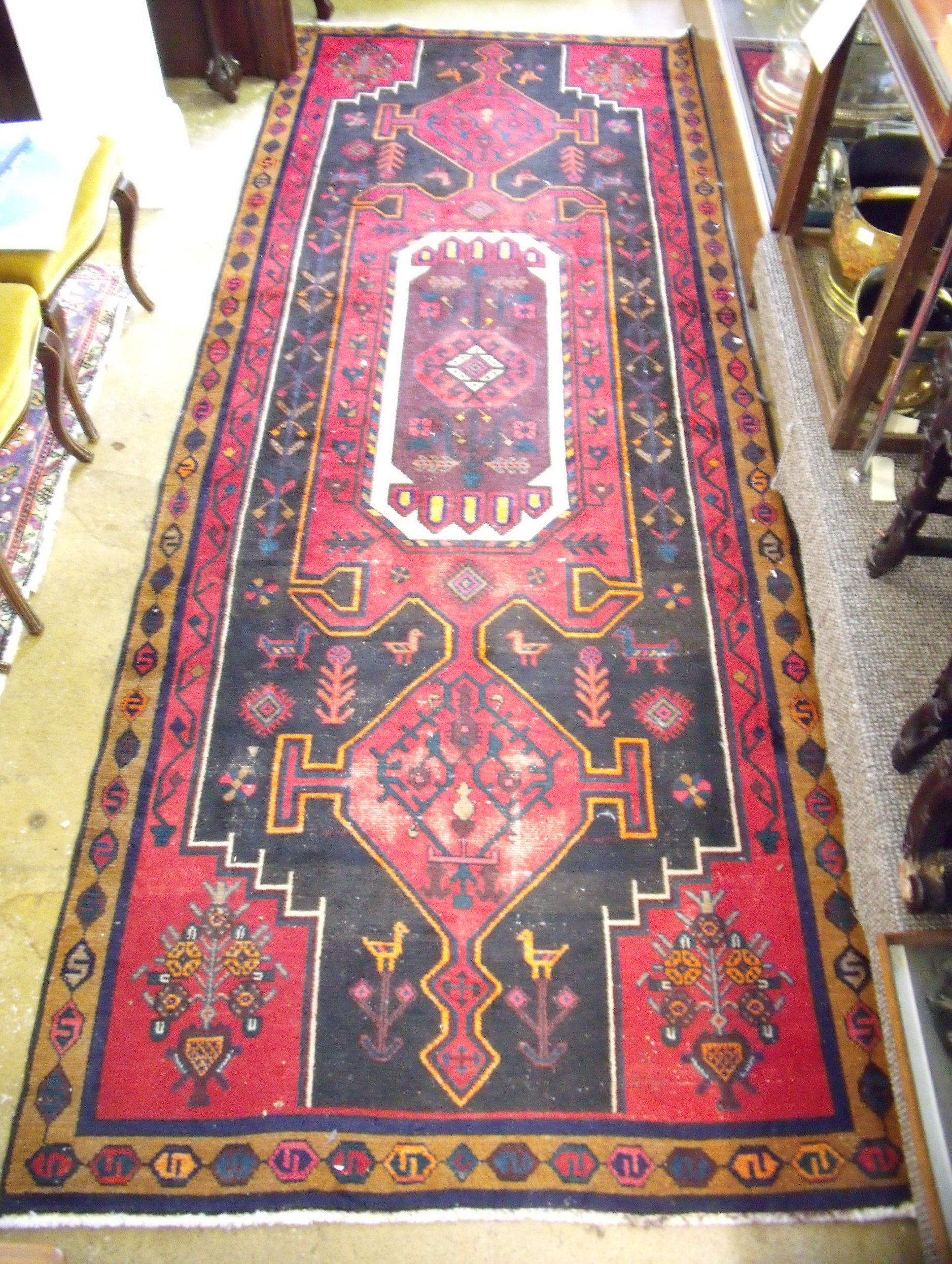 A large Iranian Hamadan runner with red ground 320 x 124cm