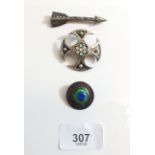 A silver Celtic brooch with Millefiori glass centre by C.G and two white metal brooches