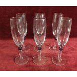 A set of six champagne glasses with purple knopped stems