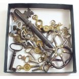 A box of watch keys and two other keys