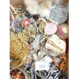 A tray of costume jewellery inc. brooches, necklaces, bracelets etc.