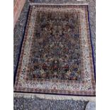 A blue ground Kashmir style rug with tree of life design 170 x 118cm