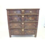 A Victorian oak chest in Jacobean style with bobbin decoration to four long graduated drawers - 91 x