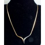 A contemporary two colour 9 carat gold necklace