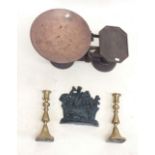 A set of kitchen scales, brass candlesticks and a door stop