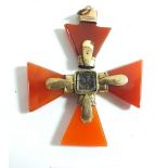 A 19th Century cornelian and gilt metal crucifix pendant with central woven hair panel 5cm wide -