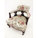 A Victorian tub armchair with slatted upholstered back