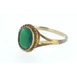 A 9ct gold ring set with a green stone - size N 1/2 to O.