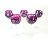 A set of five mauve bowled hock glasses