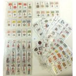 A collection of 250 Wills and John Player cigarette cards of military interest including Badges
