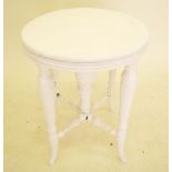 A Victorian white painted circular stool, originally a piano stool