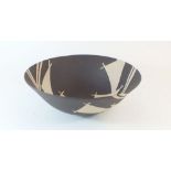 A black and white studio pottery bowl - 25 cm diameter