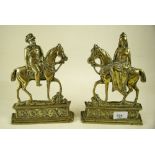 A pair of brass fire dogs in the form of Queen Alexandra and King Edward VII