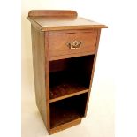 An Edwardian mahogany bedside table with drawer over two shelves - 35cm wide