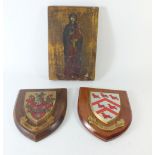 Two oak armorial plaques 15 x 18cm and a painted wood icon of the Virgin and child