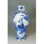 A Chinese Kang Hsi blue and white baluster vase painted figure of a women with flowers, 26cm